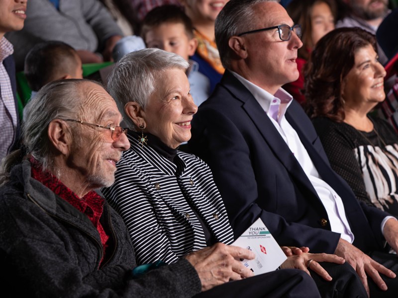 Patrons in green seats