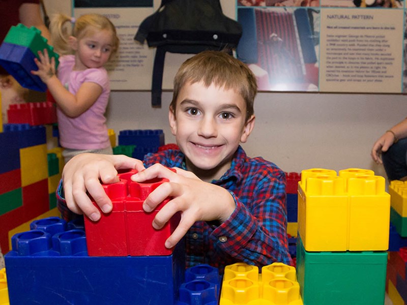 Boy playing with blocks in the museum