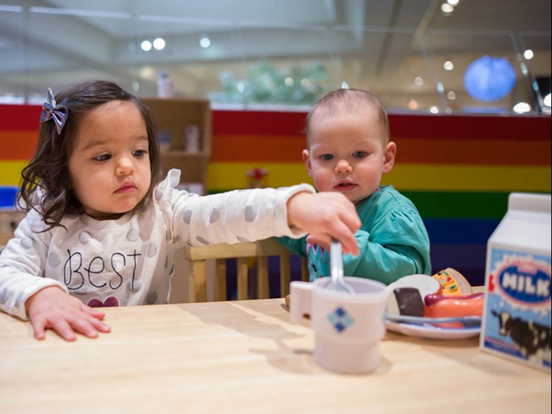 Toddlers playing in museum